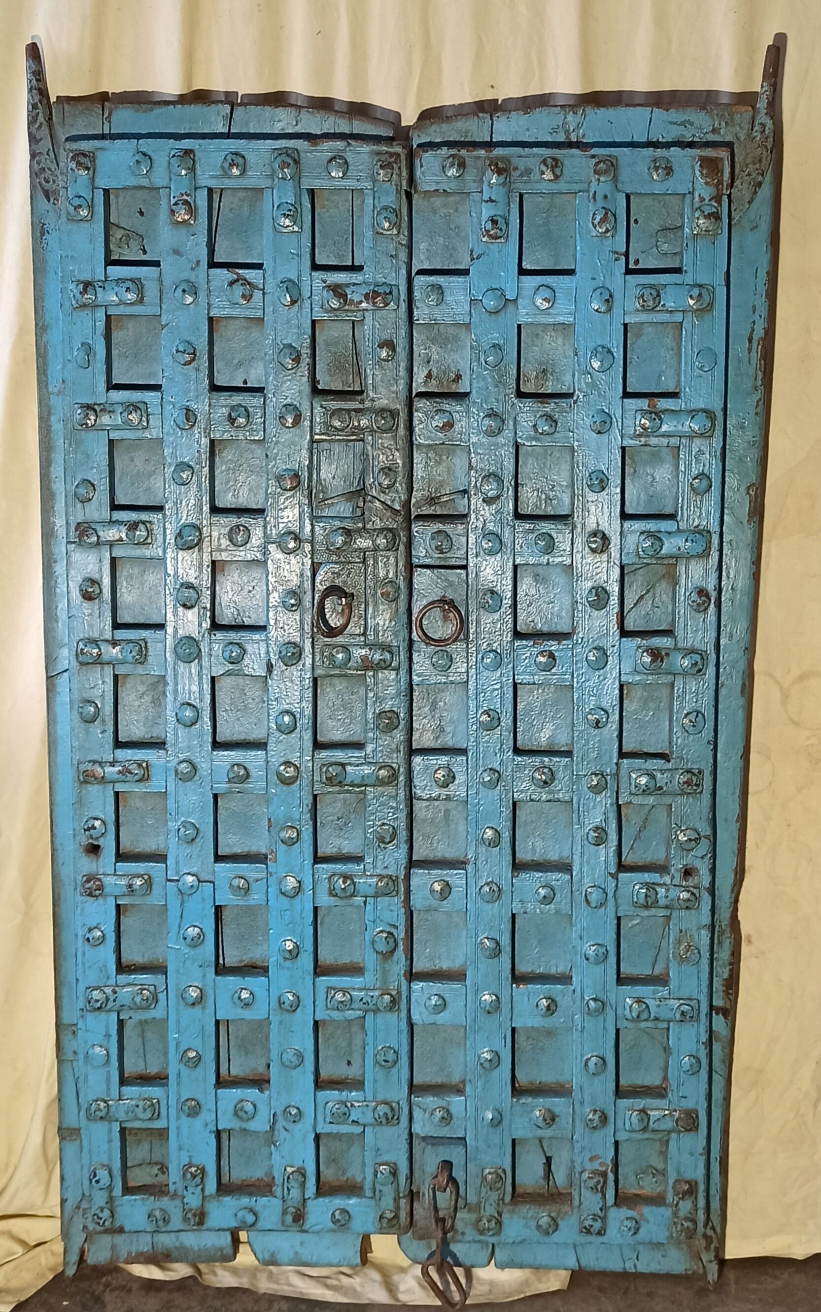 Old blue wooden door with braces