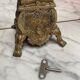 Fireplace trim clock and adornment of antique bronze candelabra
