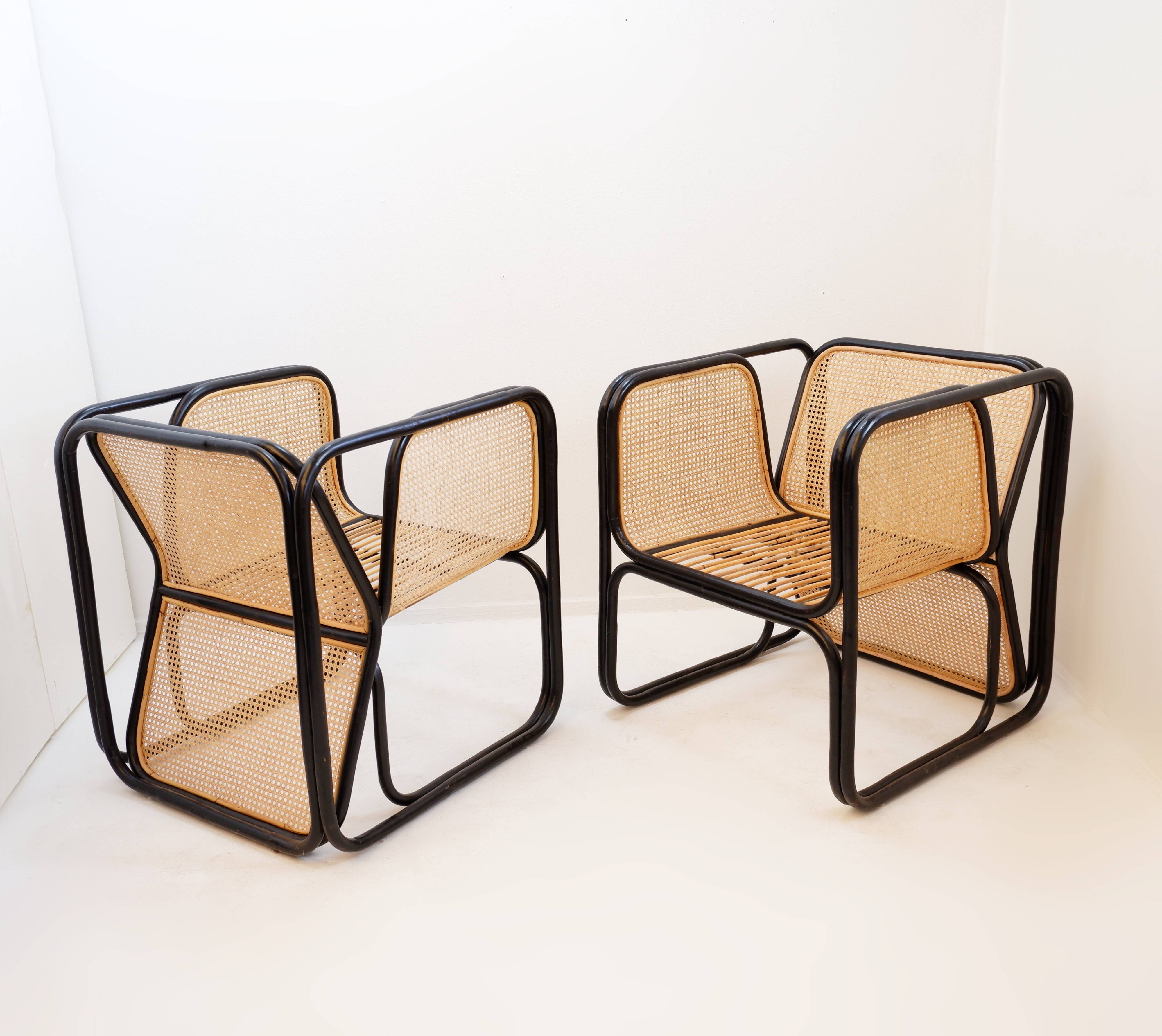 Pair of designer armchairs in curved wood and wicker