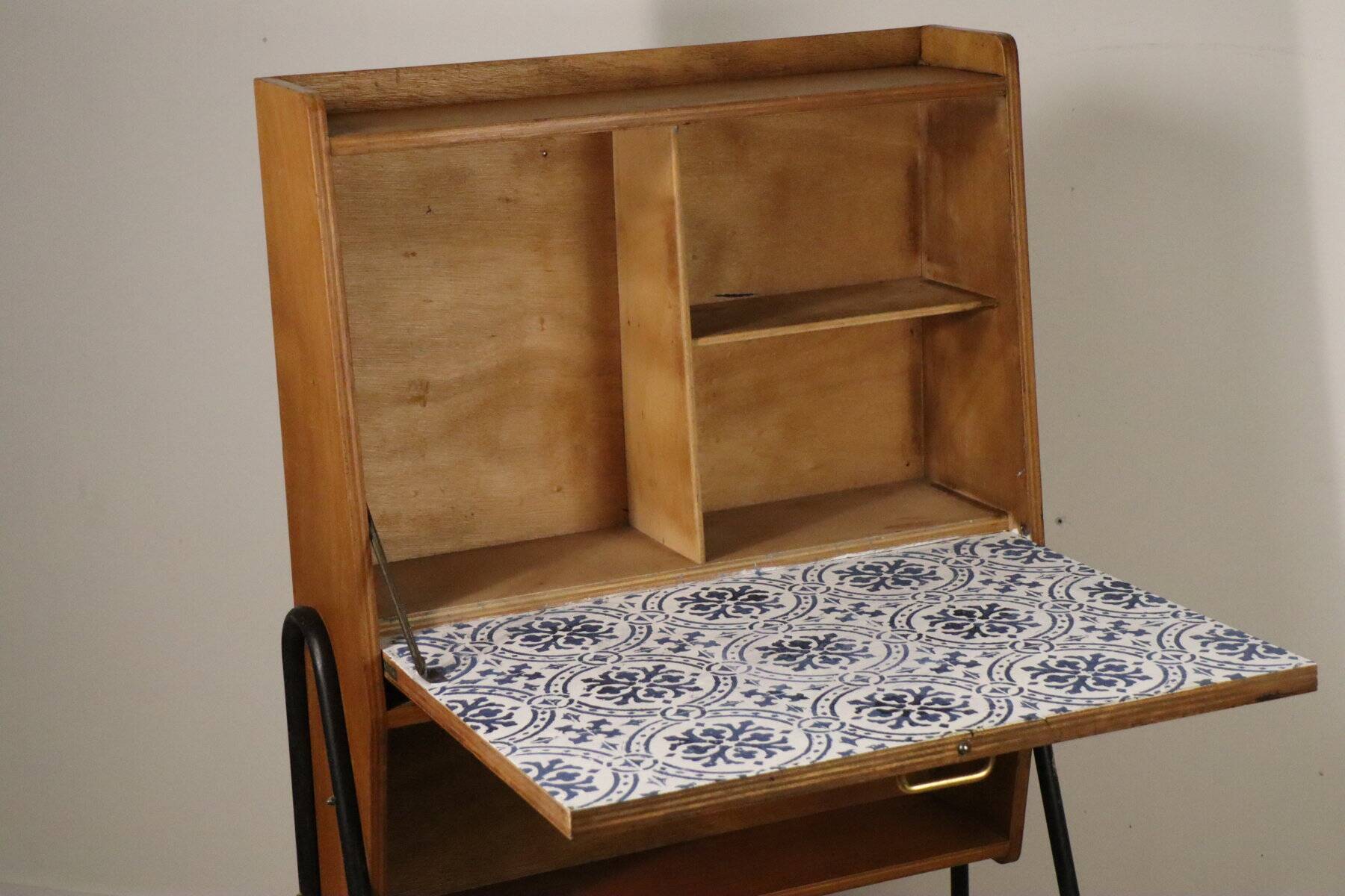 Vintage 1960s wooden secretary with metal legs.