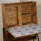 Vintage 1960s wooden secretary with metal legs.