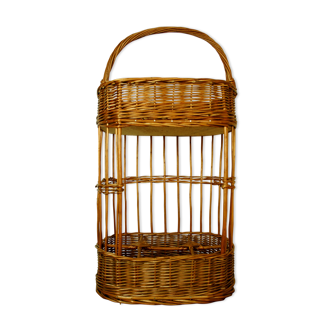 Wicker basket carries vintage nomadic bar bottles