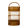 Wicker basket carries vintage nomadic bar bottles