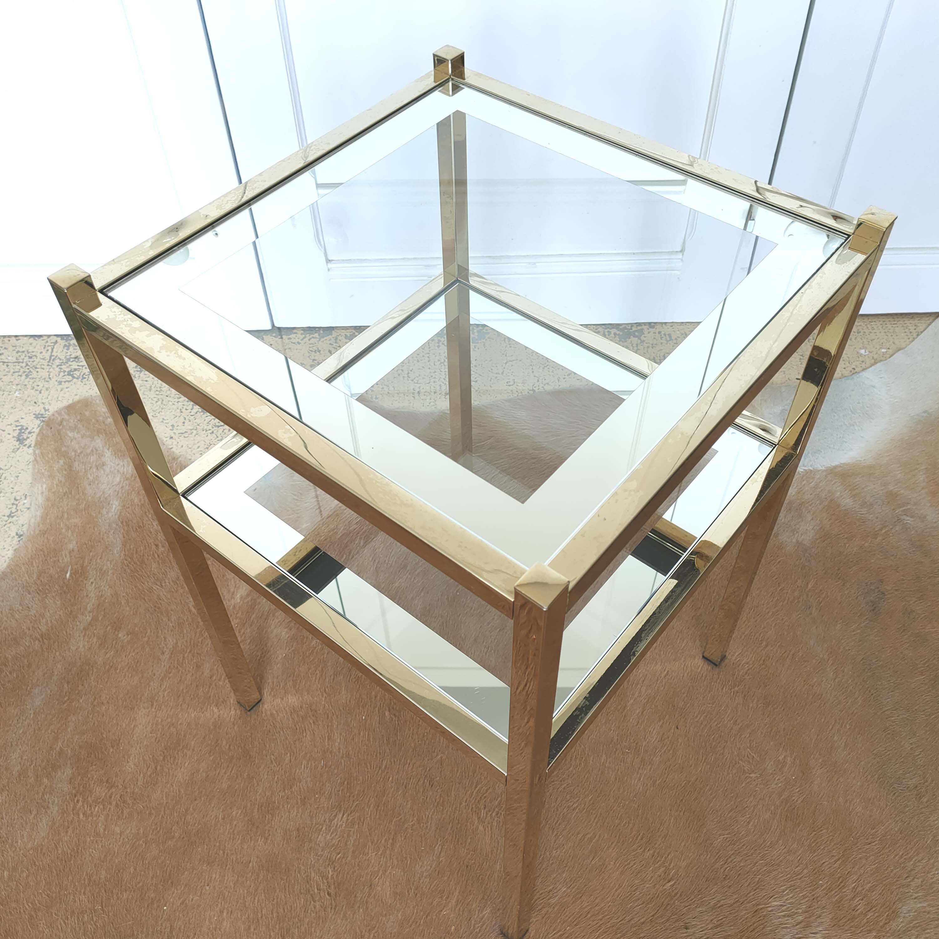 Golden sofa tip and mirror glass