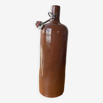 Old hot water bottles in glazed sandstone
