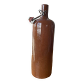 Old hot water bottles in glazed sandstone