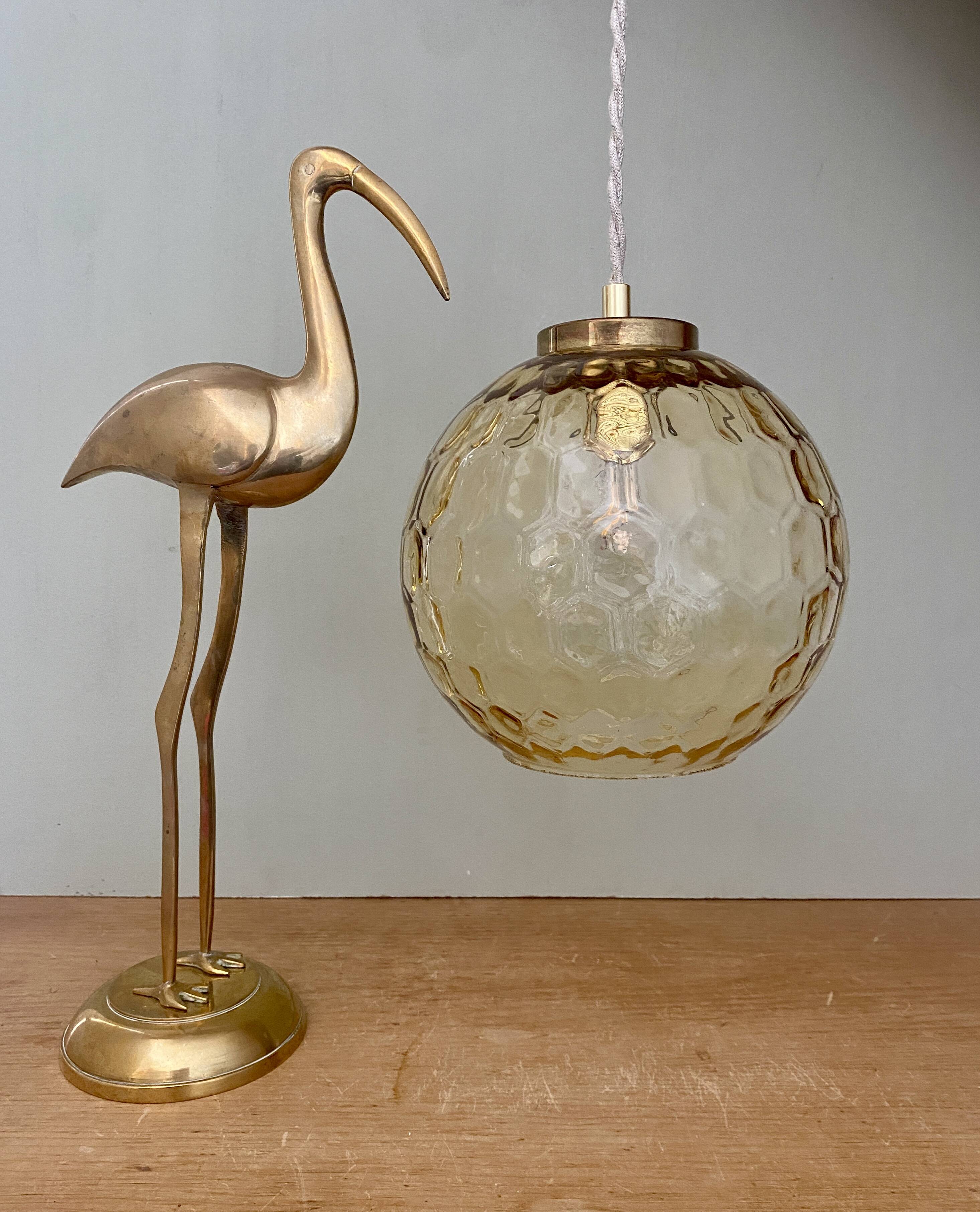 Vintage globe pendant light in amber glass