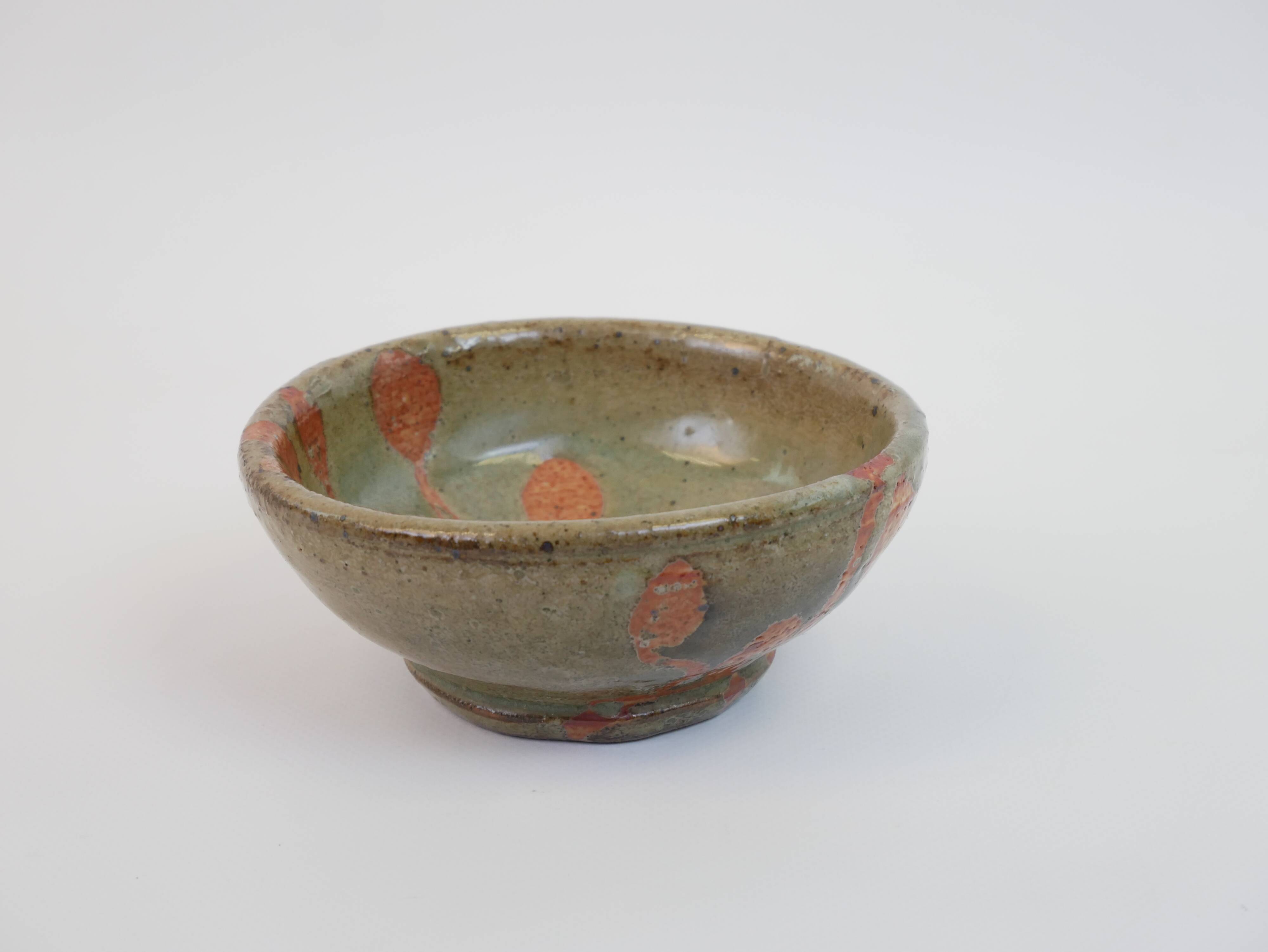 Small bowl in water green glazed ceramic with coral pink pattern