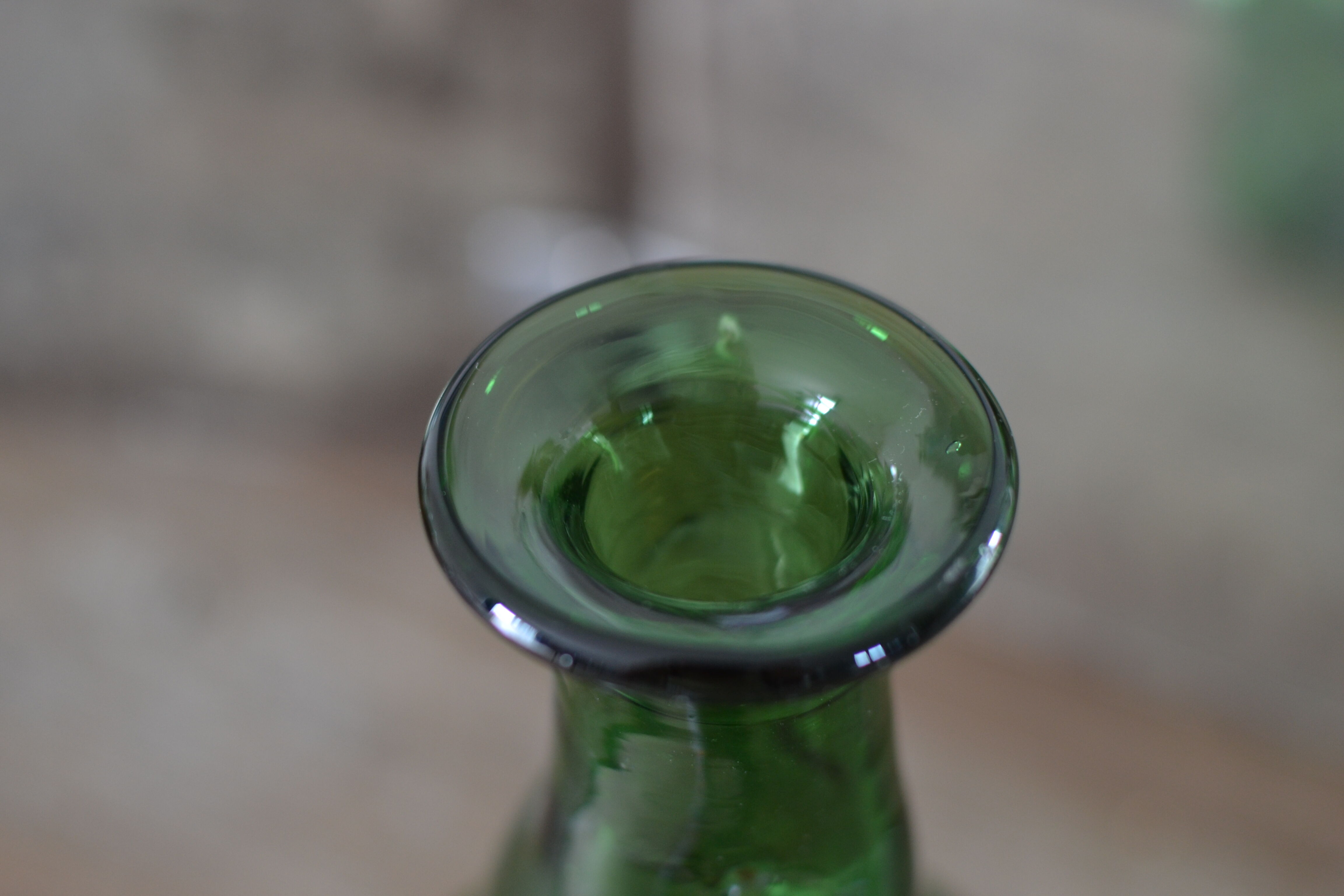 Dented green bottle