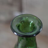 Dented green bottle