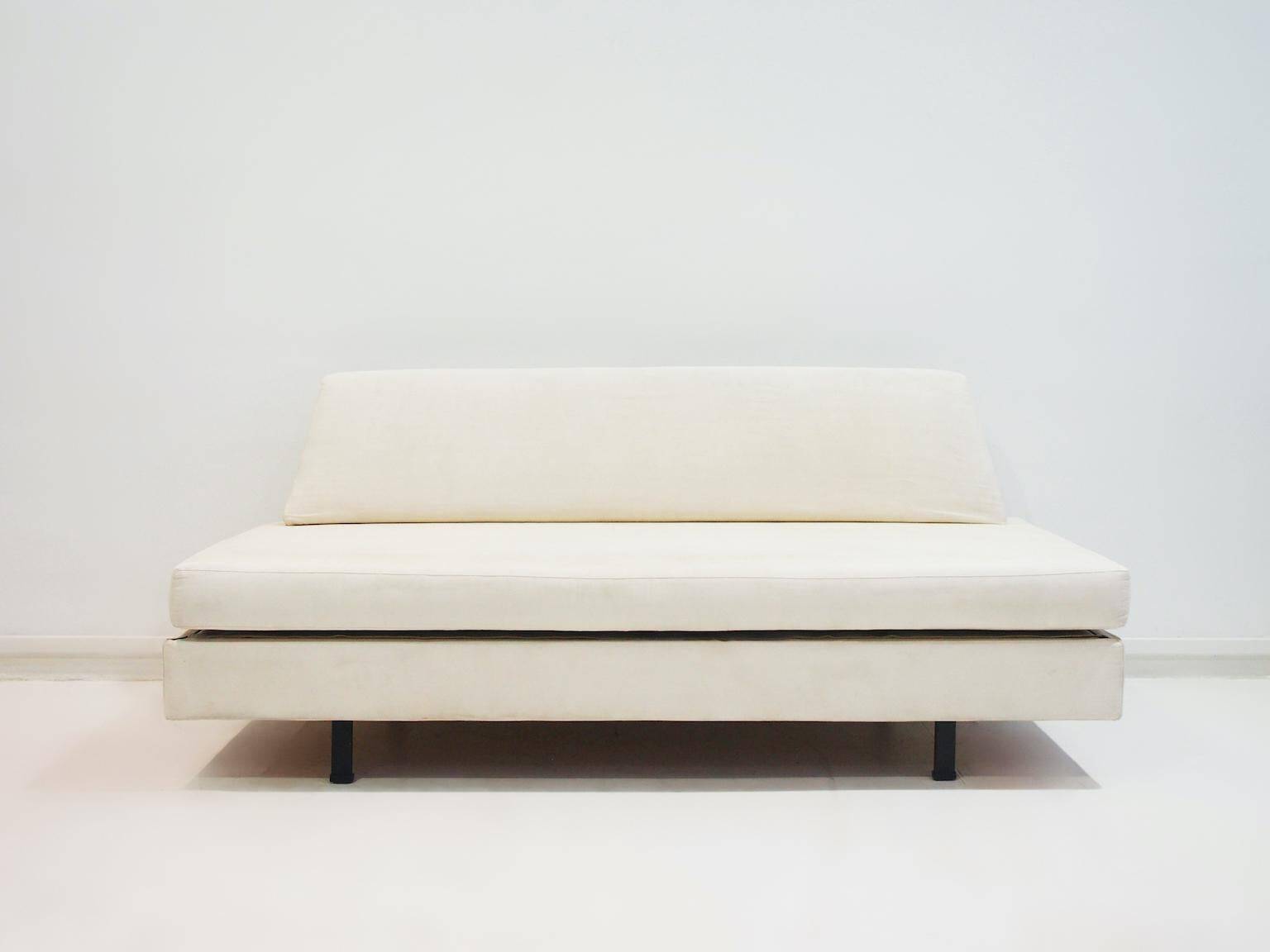 Italian modernist daybed with white upholstery and iron frame.