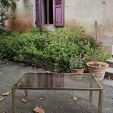 Table basse laiton plateau verre fumé