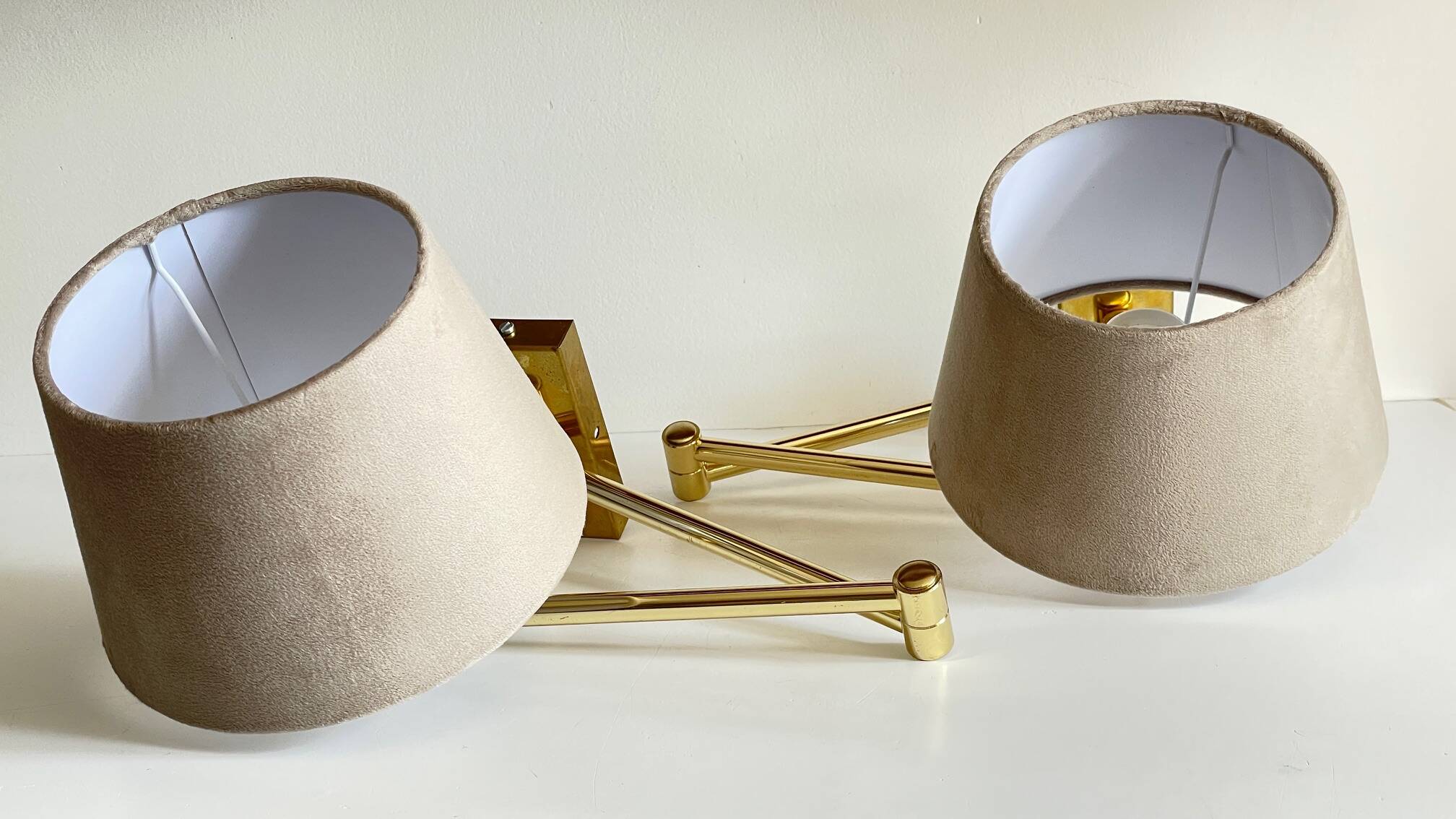 articulated brass and velvet wall light