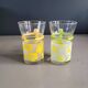 Pair of glass teacups with plastic handles