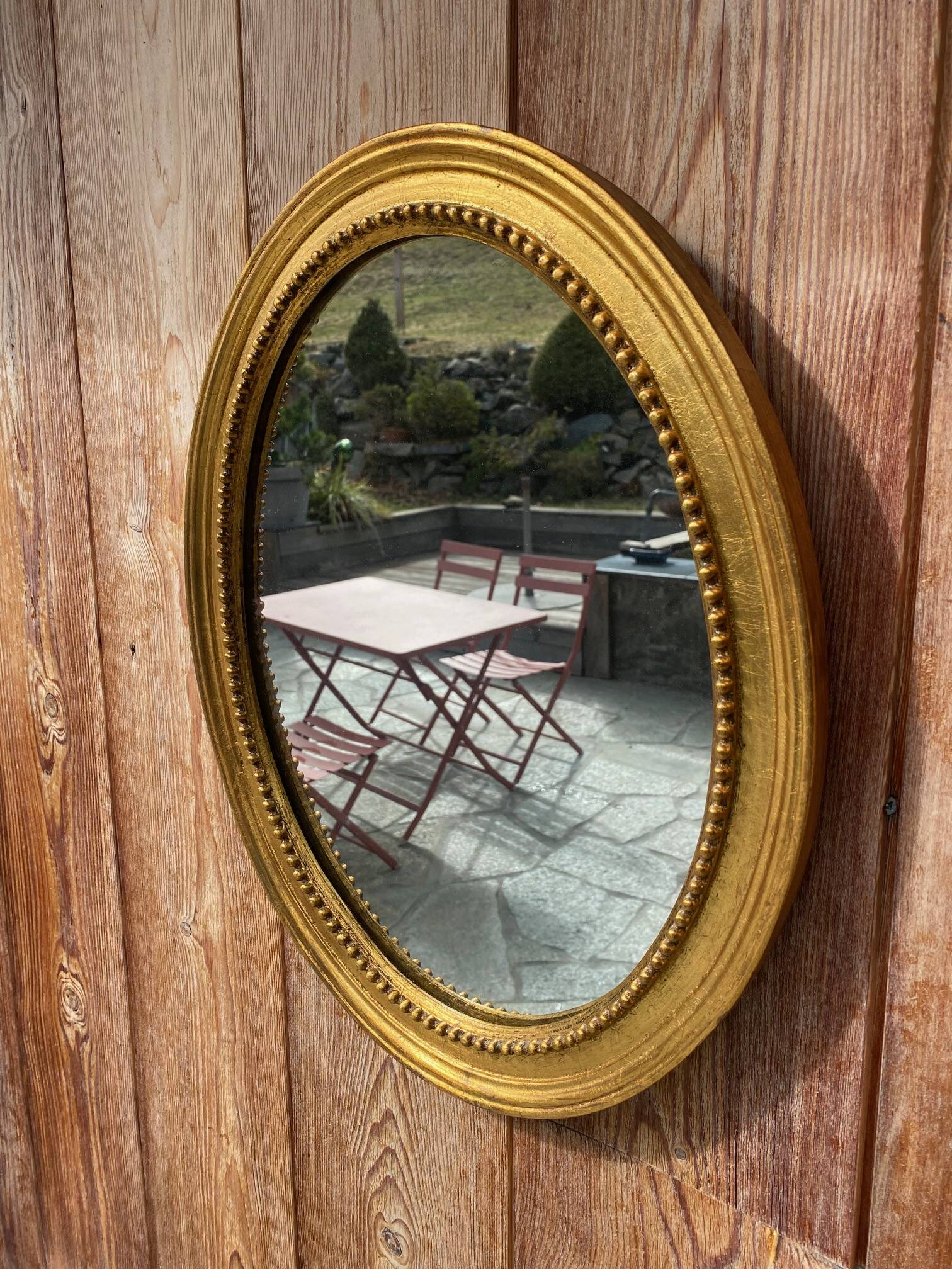 Antique gold oval mirror