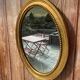 Antique gold oval mirror