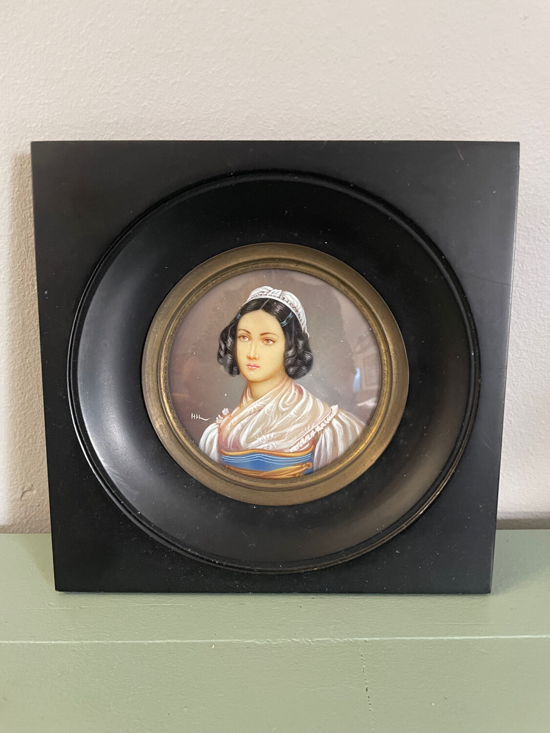 Old miniature portrait painting of a woman.