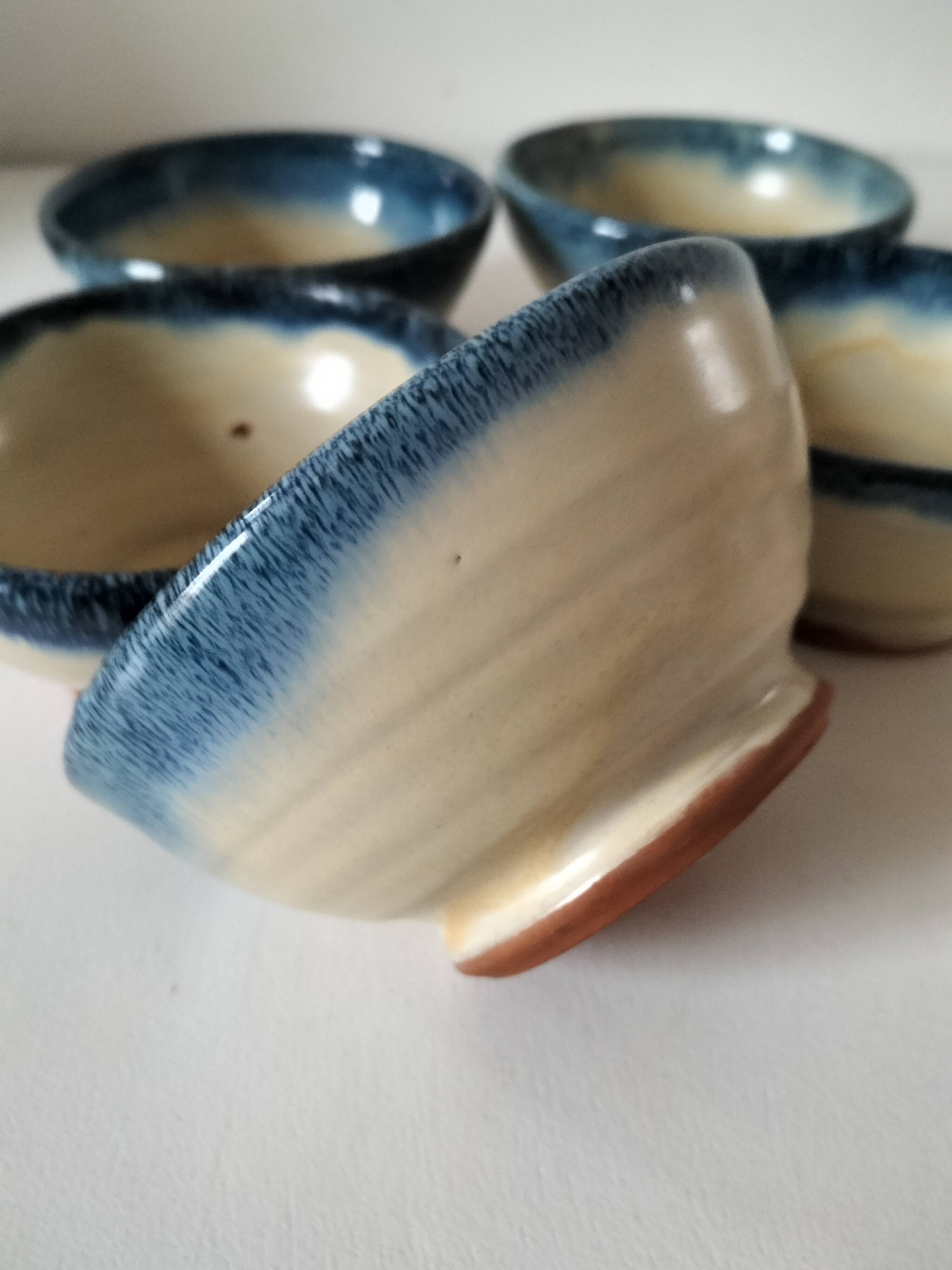 Set of 5 small blue and cream glazed stoneware bowls