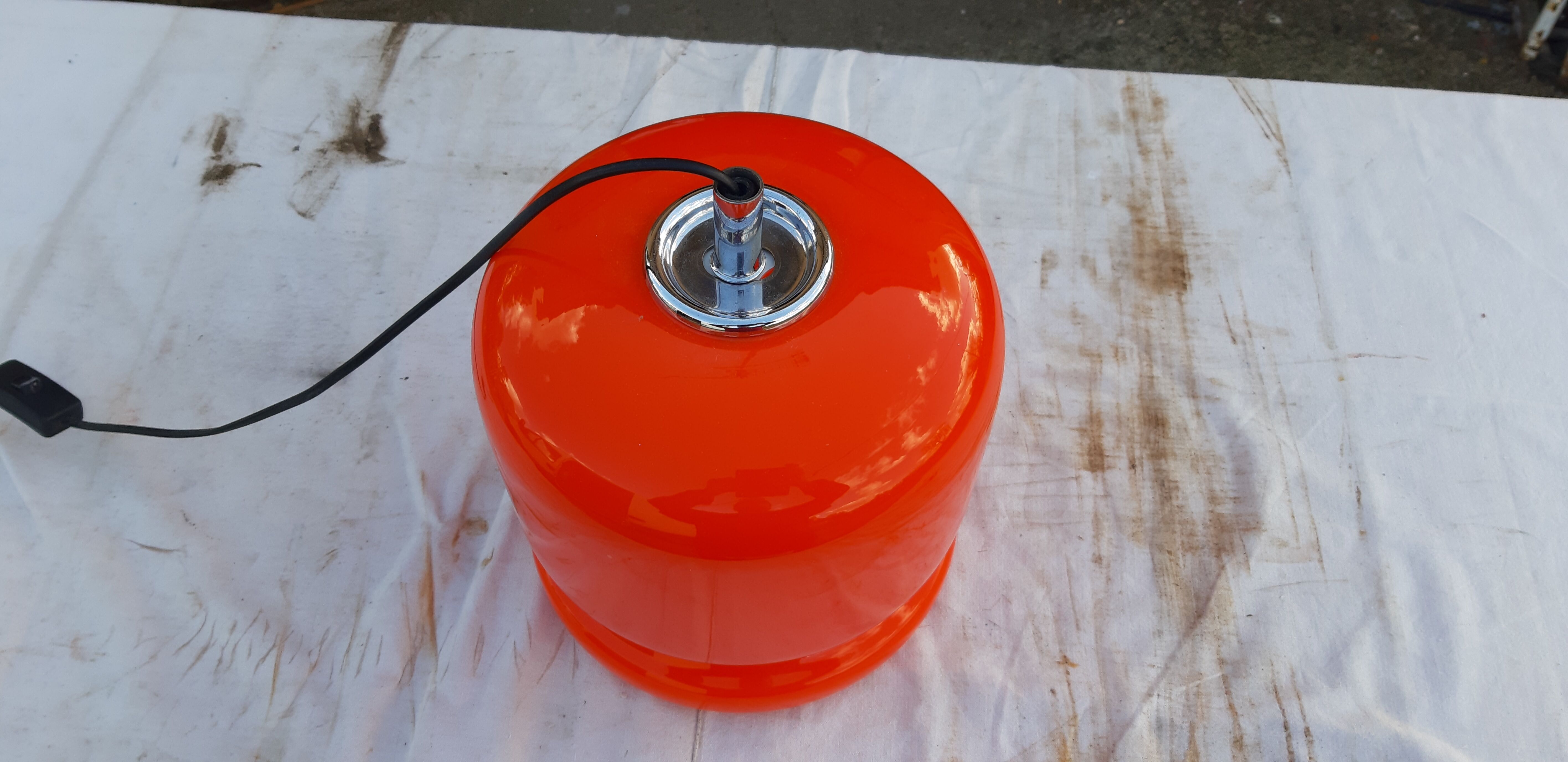 Vintage lamp of the 70s in orange opaline