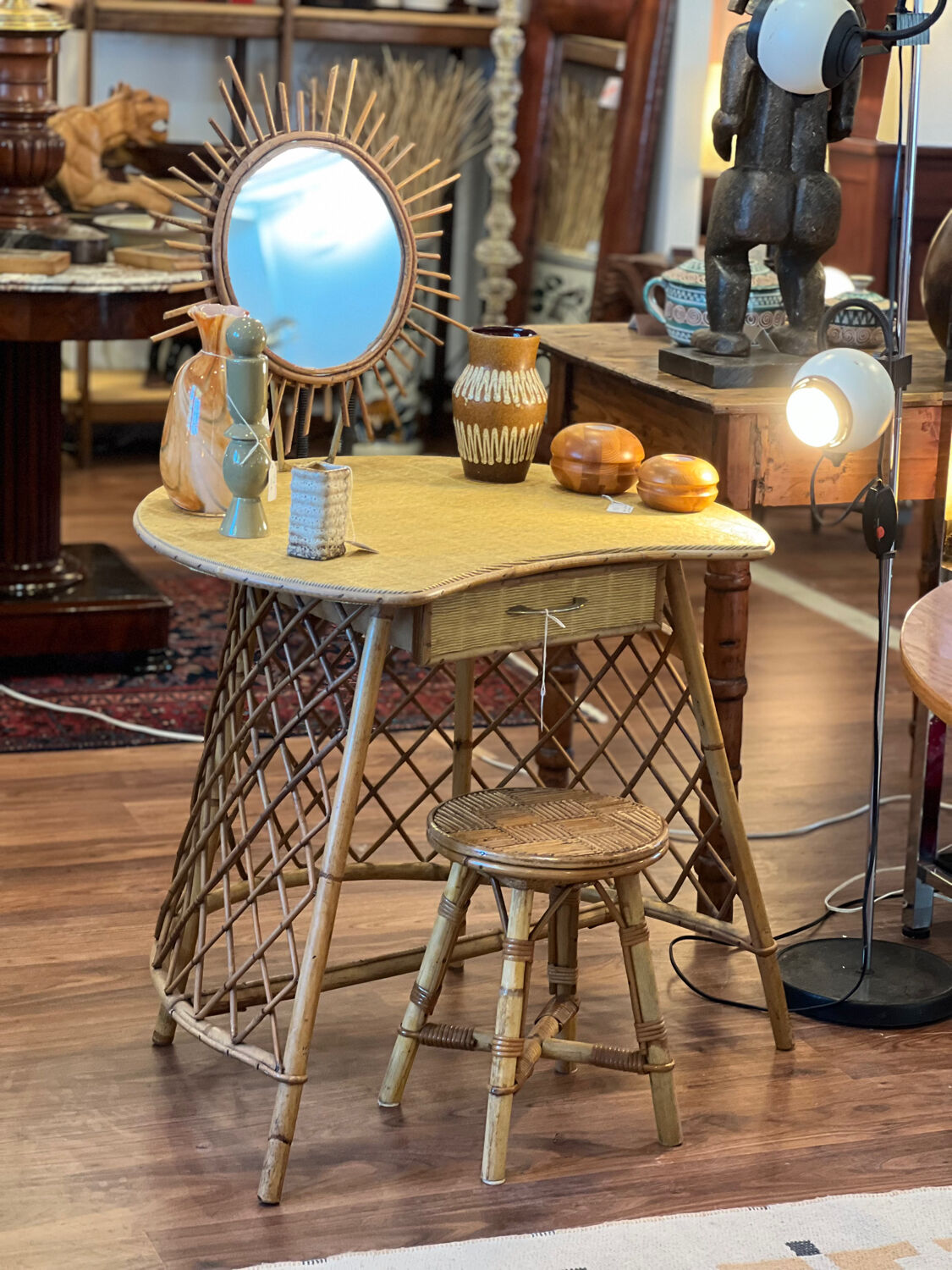 Rattan dressing table with sun mirror and its stool.