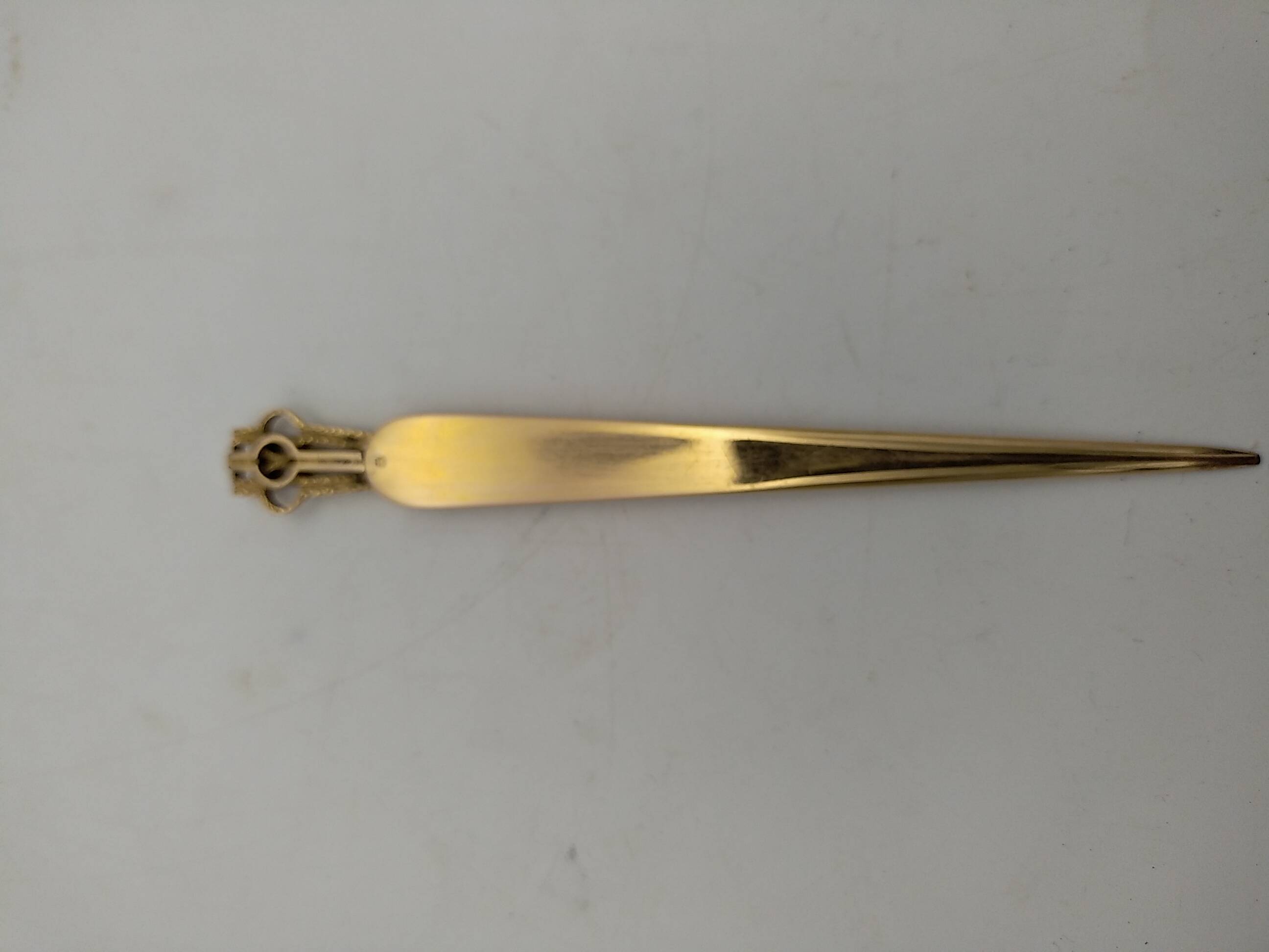 Gold plated letter opener.