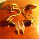 Wall lamps in gilded metal, verrine in the shape of amber glass corollas, 70s