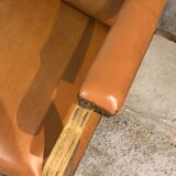 Old Voltaire armchair in light brown leather