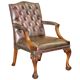 Gainsborough armchair George II leather Chesterfield hand-carved with claw and ball feet.