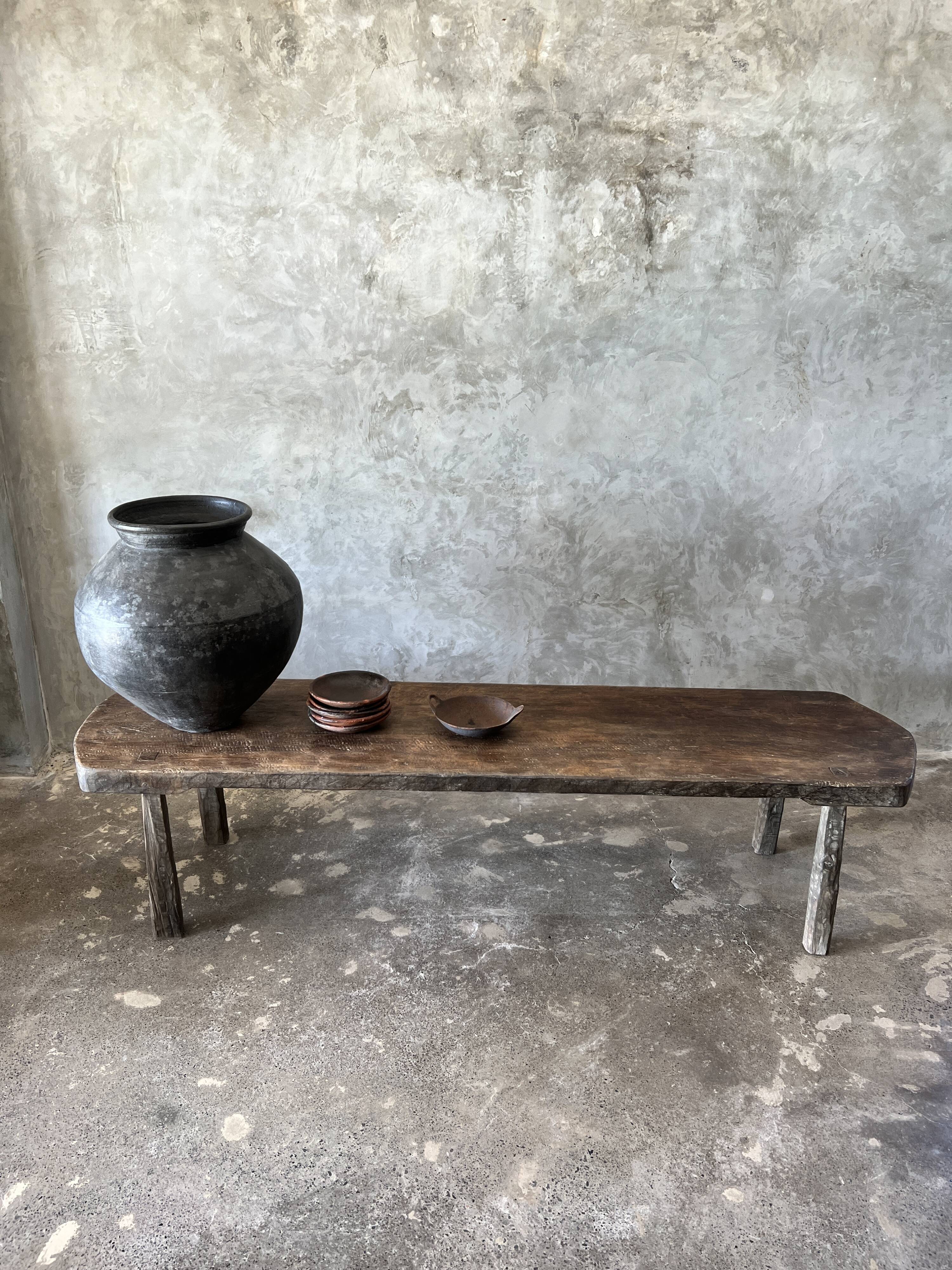 Large rounded coffee table in old Asian teak