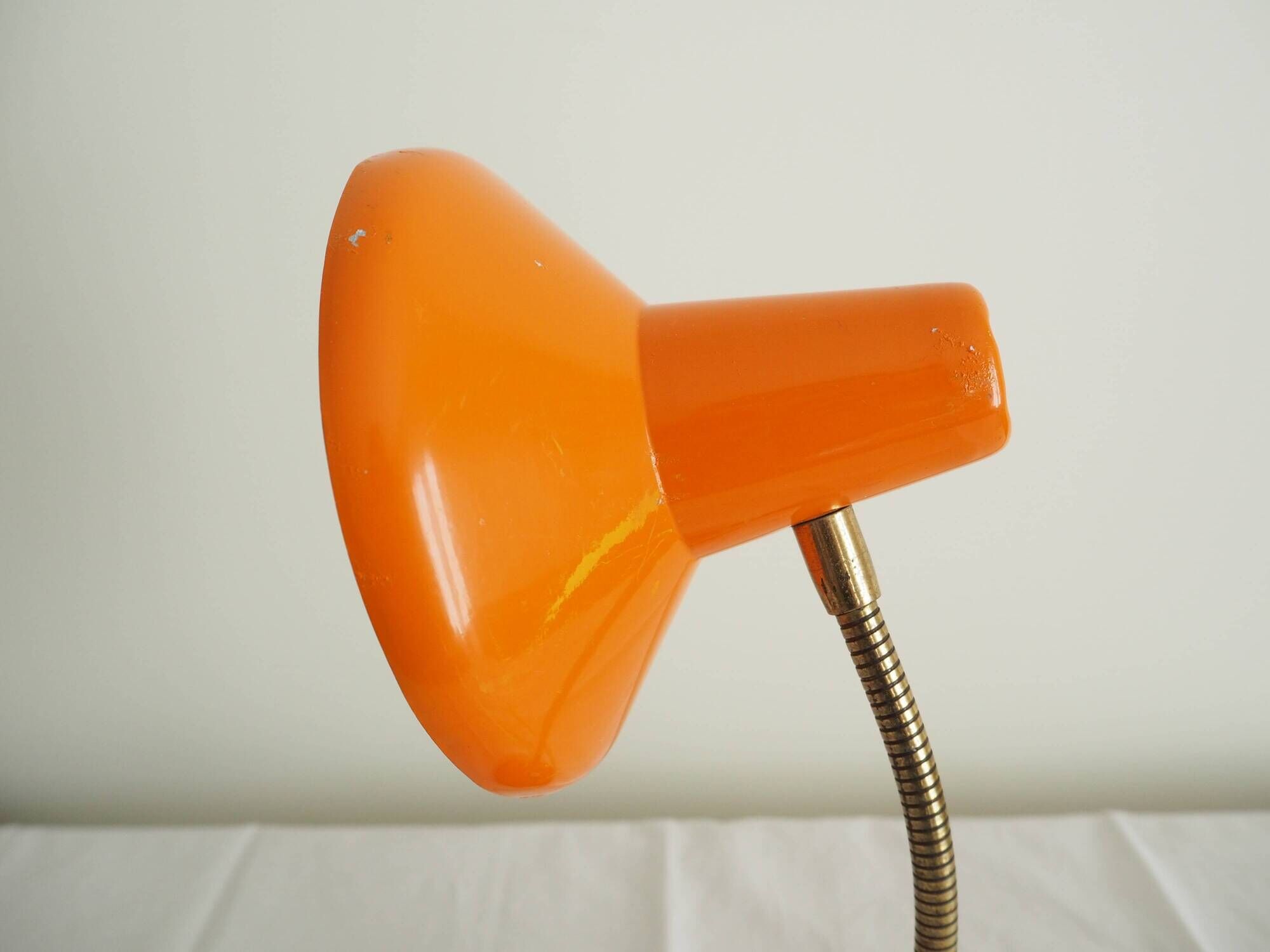 Orange colored metal desk lamp from the 1960s-1970s