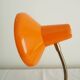 Orange colored metal desk lamp from the 1960s-1970s