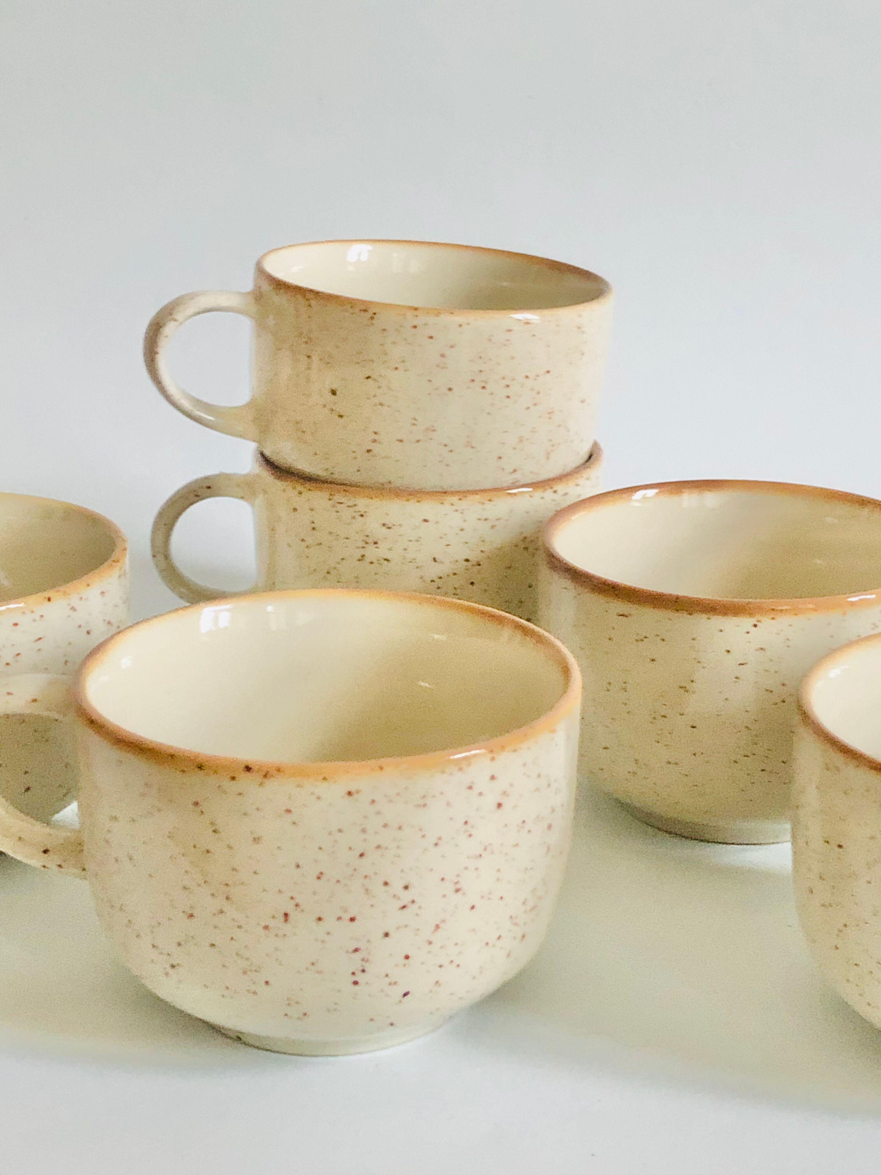 Set of 9 speckled ceramic coffee cups