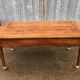 Antique solid cherry farmhouse table with 2 end drawers and 1 pull-out.