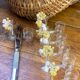 Knife rests, flower vases and candle holders in blown glass.