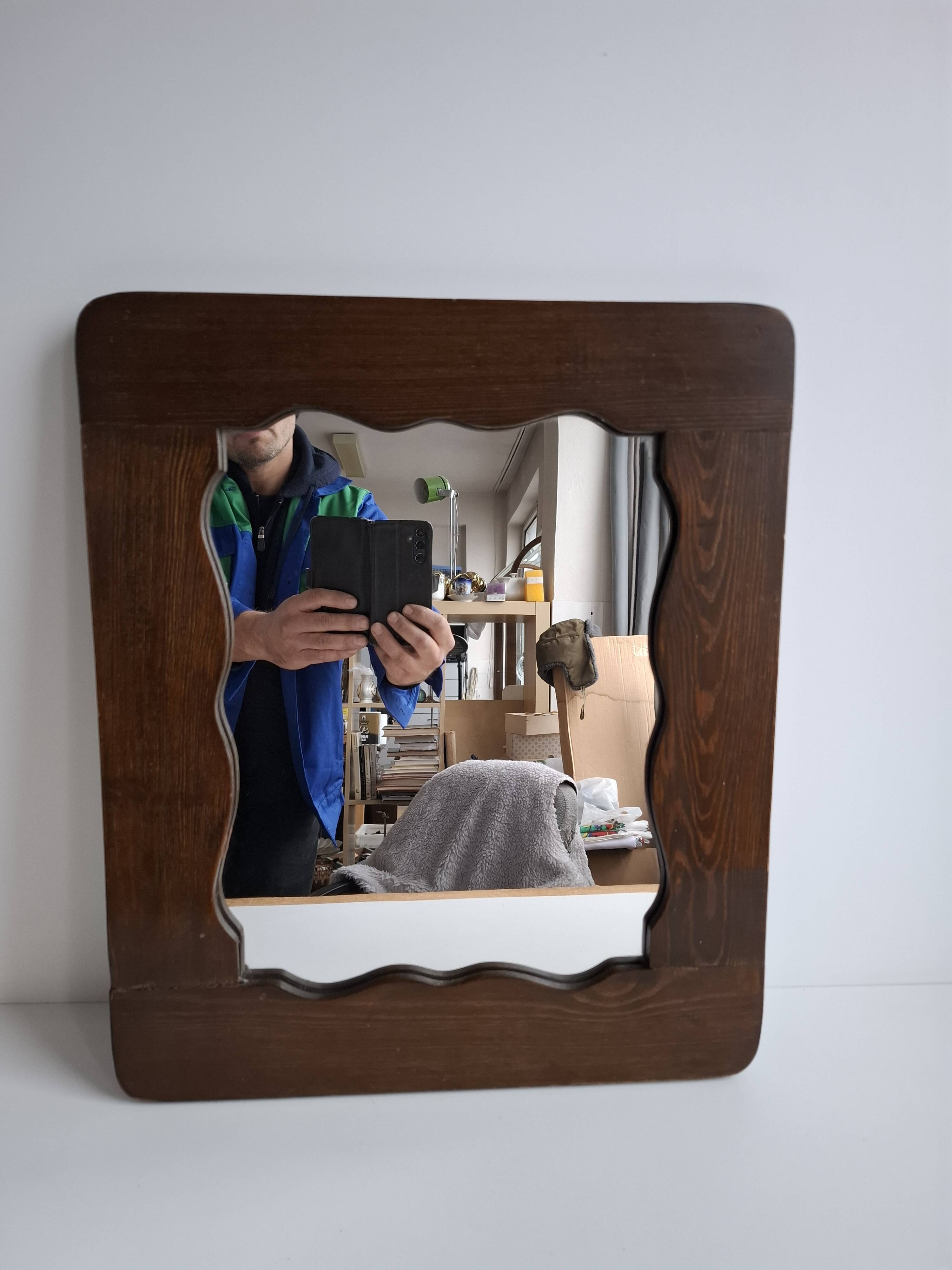 Czechoslovakian wall mirror with a wavy wooden frame, mid-century, 1940s