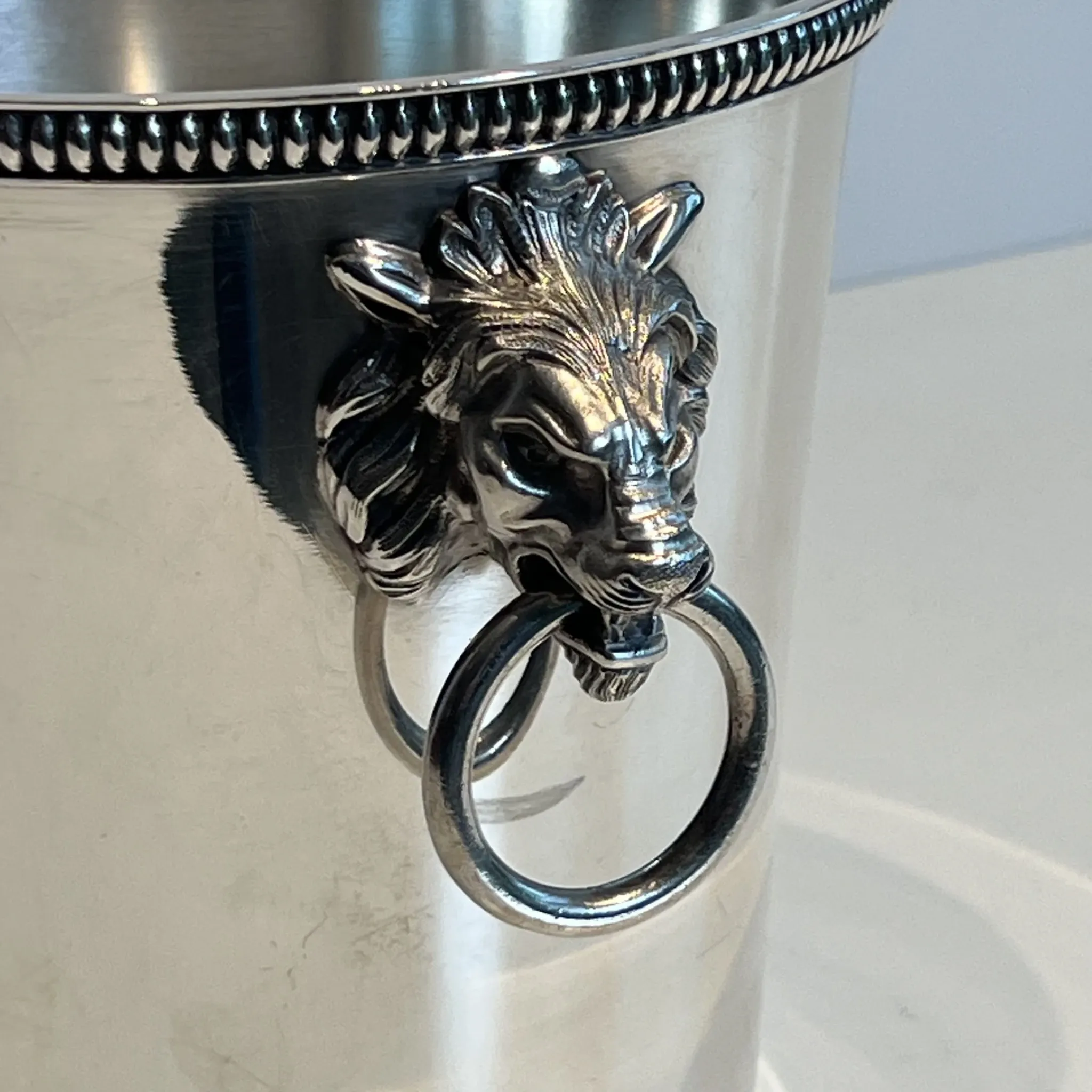 Silver-plated champagne bucket Orfèvrerie Saint-Médard. Handles in the shape of heads.