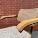 Cesca model chair designed by Marcel Breuer with black-framed armrests