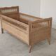 Children's bed in wood and sandblasted rattan from the 1960s.