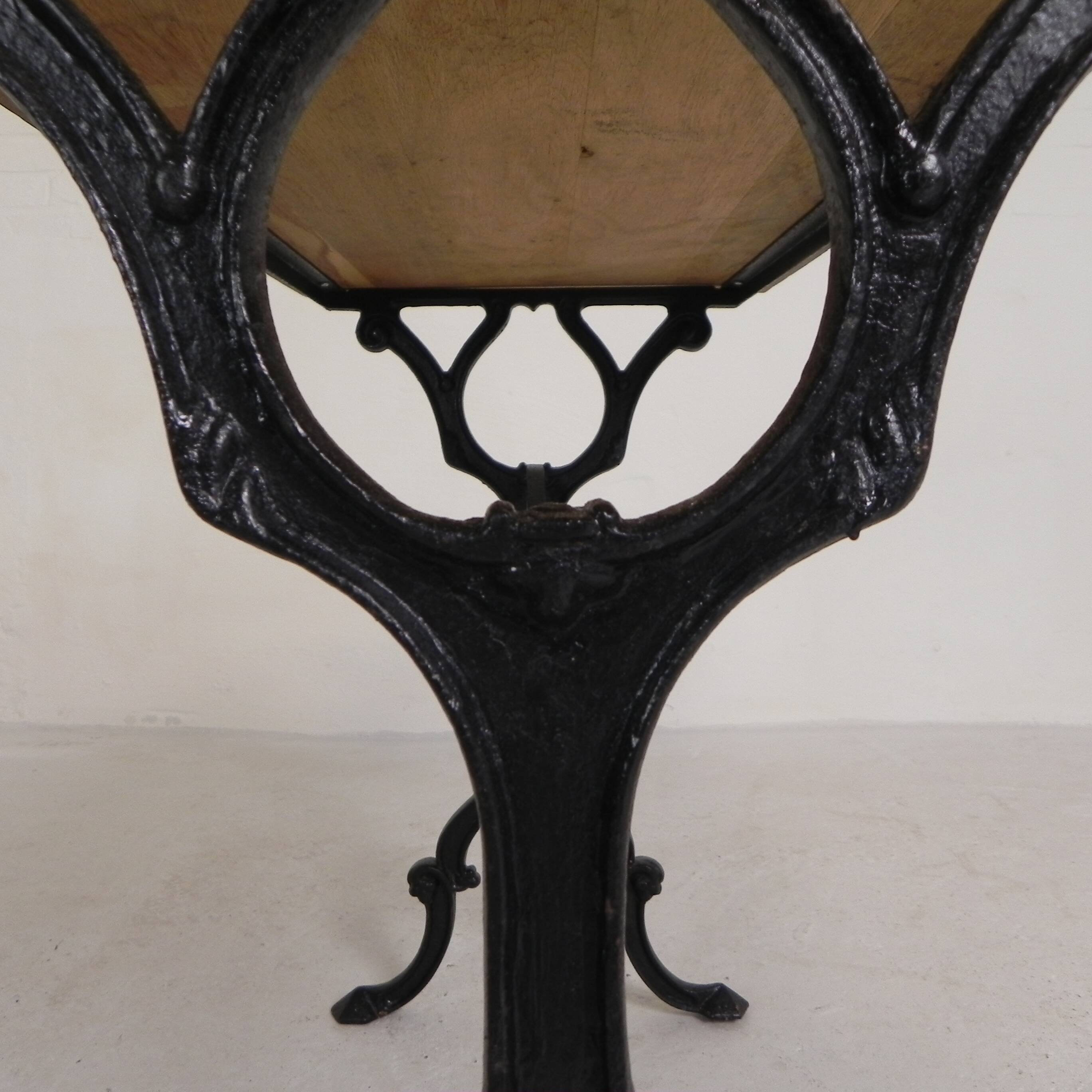 Bistro table with an oak top on a cast iron base, 1930s.