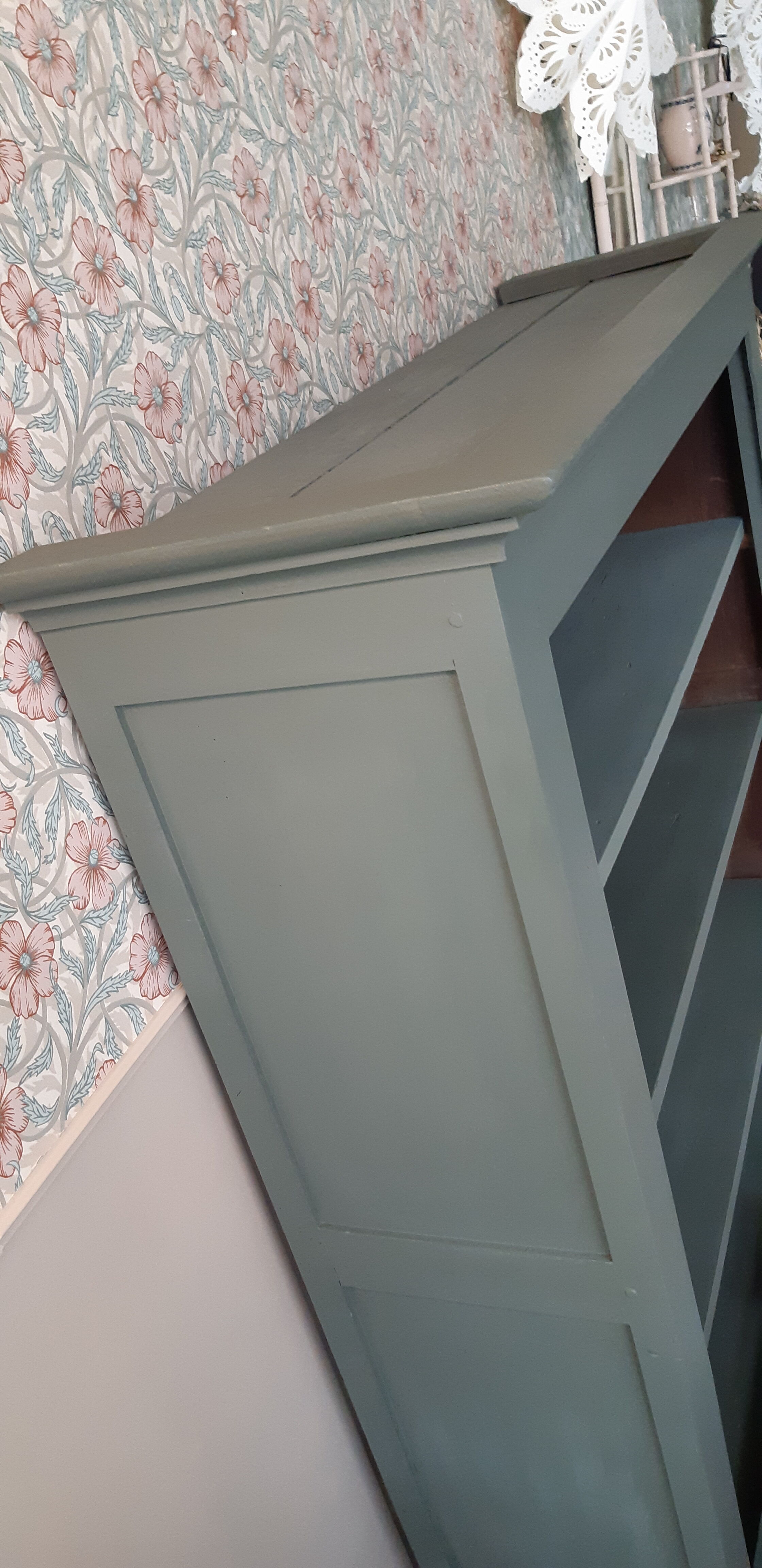 Wood and khaki green bookcase