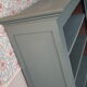 Wood and khaki green bookcase
