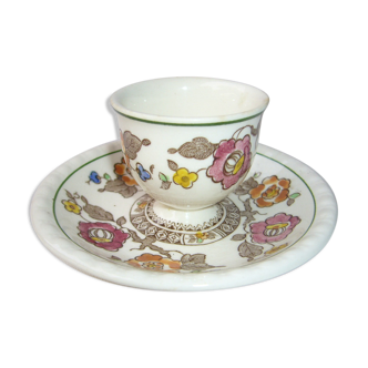 old-time cockroach with floral decoration with its cup