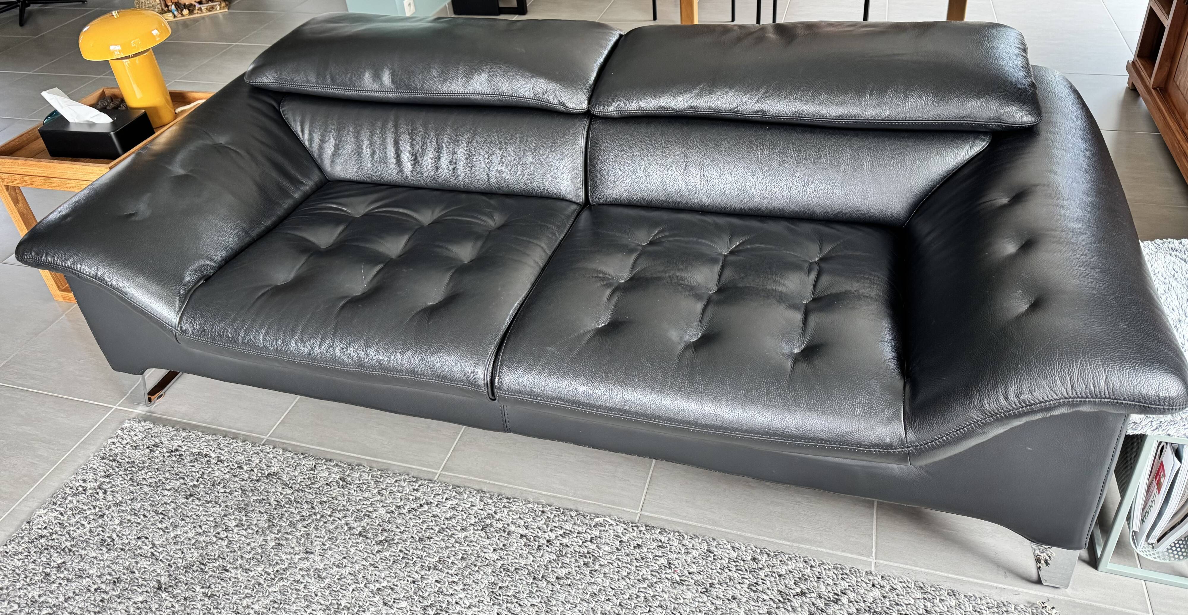 Two-seater black leather sofa Roche Bobois
