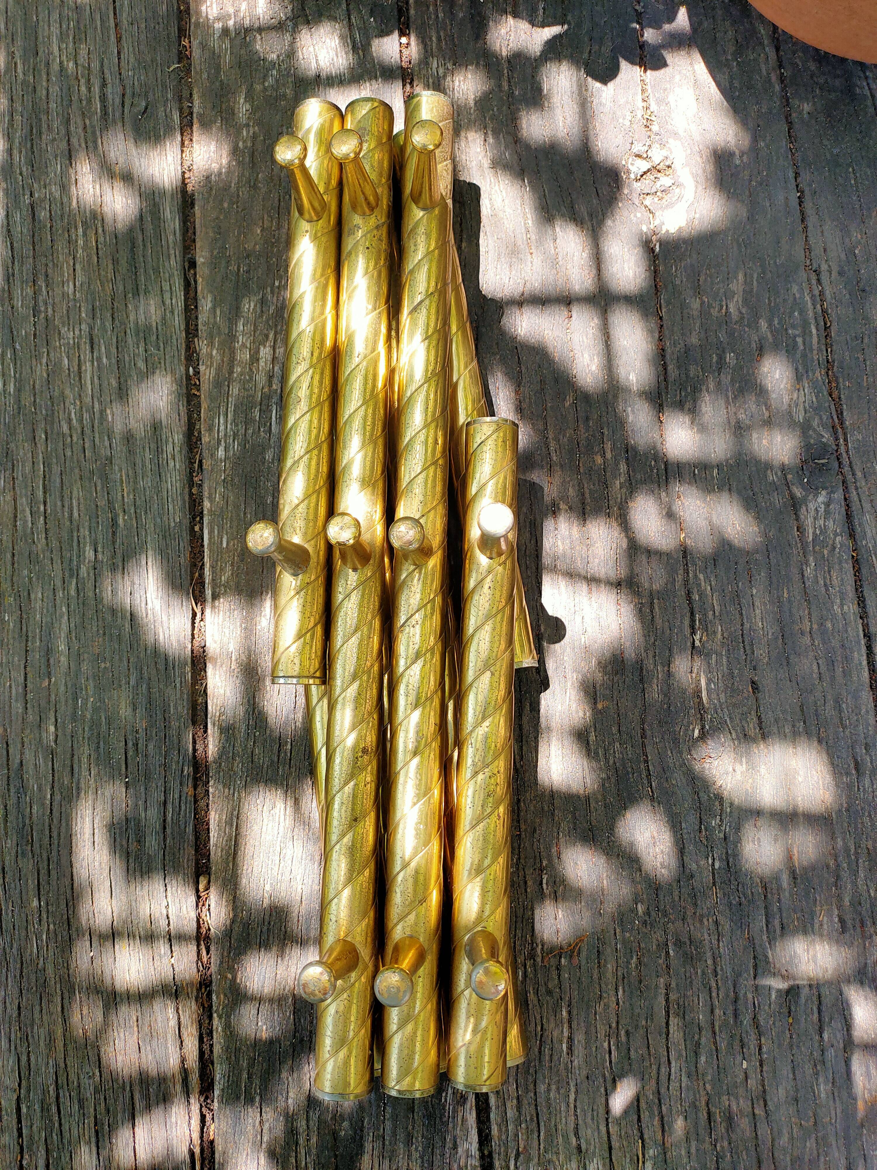 Wall coat rack in gilded metal