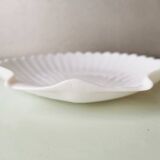 White ceramic dish shaped like 80s shells