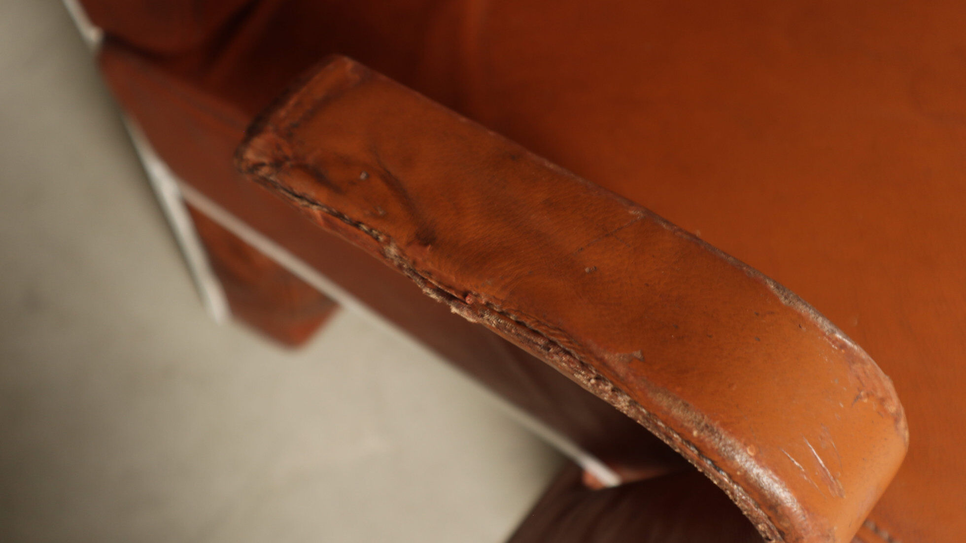 Pair of sculptural cognac leather armchairs, 1970s