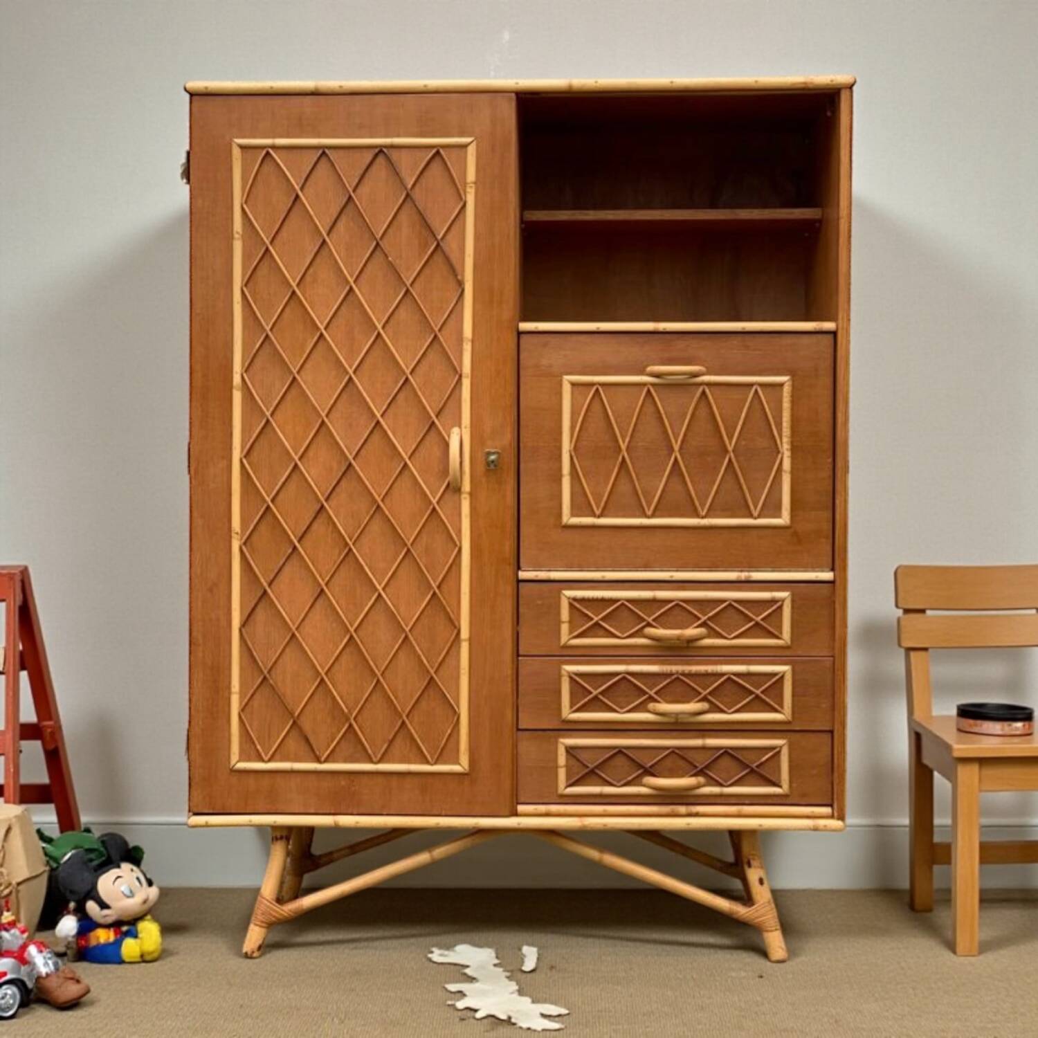 Rattan wardrobe with tapered legs from the 1960s.