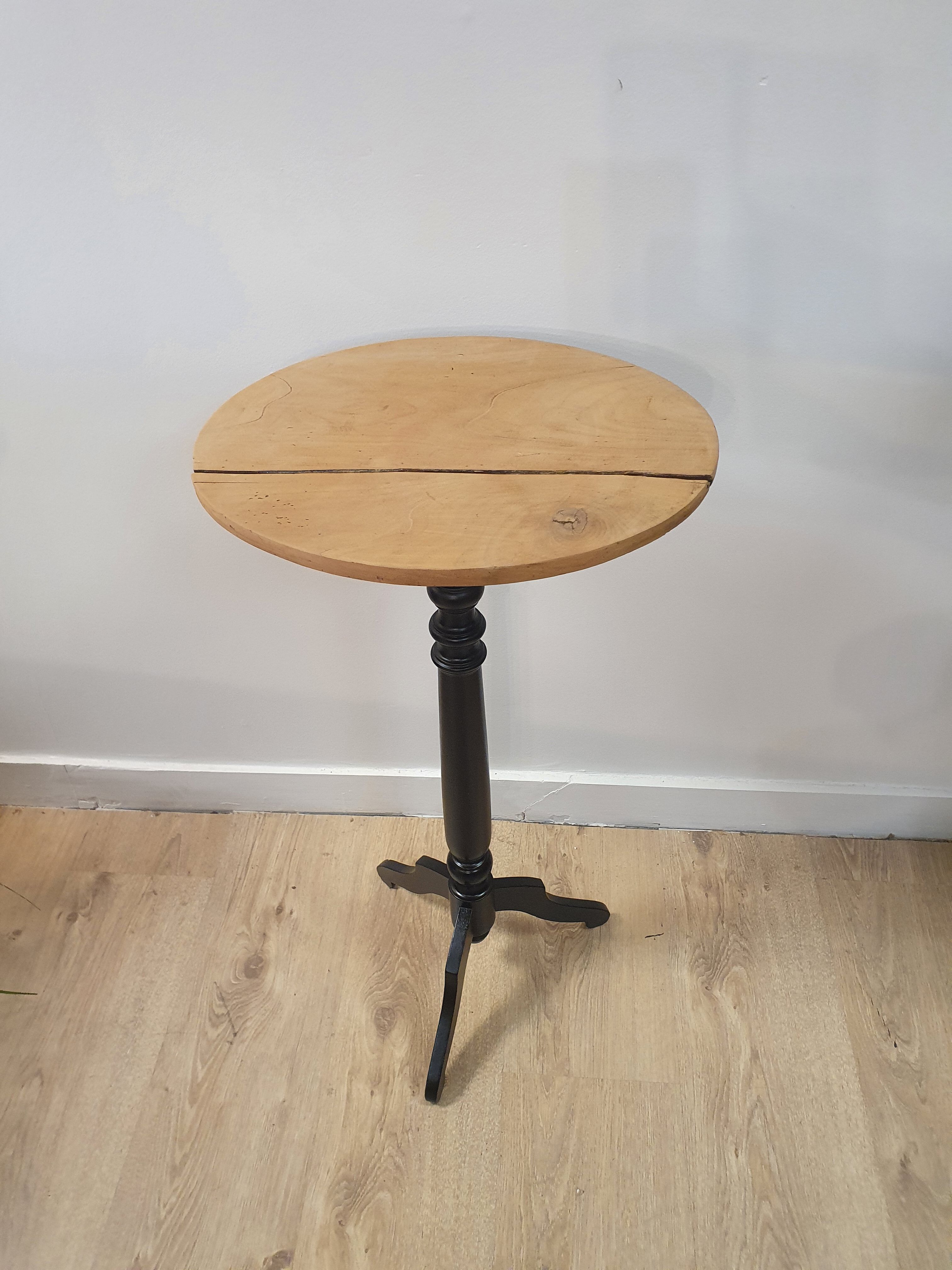 Black and wood pedestal table