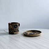 Signed ceramic mug.