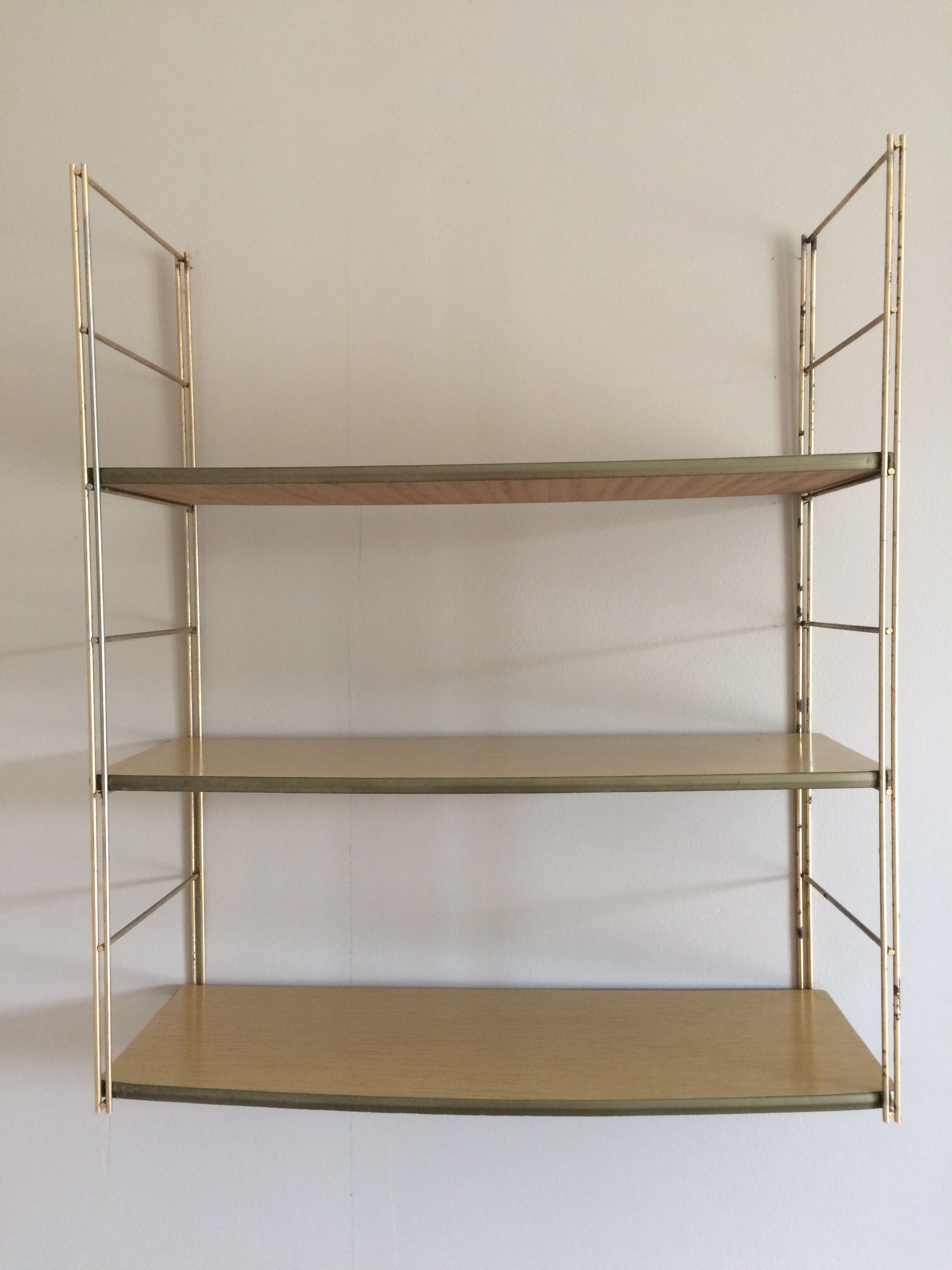 String shelf with wooden trays and formica